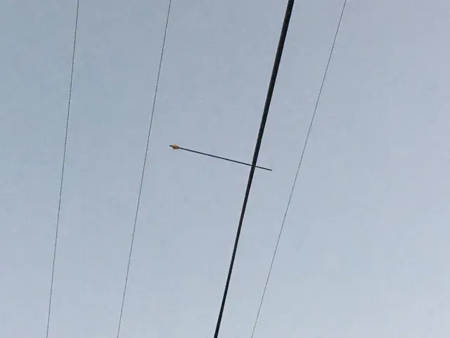 Arrow through power line