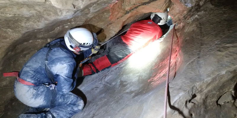 man wedged in the Laundry Chute in Rat's Nest Cave